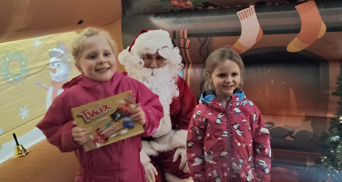 Santa and children with selection boxes